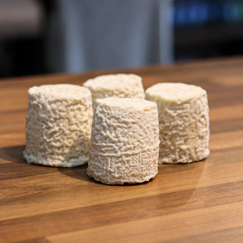 Close up of rare artisan cheese with unique texture and rind