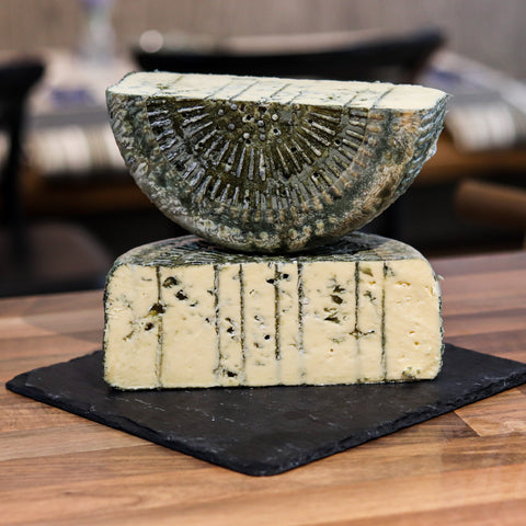 Close up of rare artisan cheese with unique texture and rind