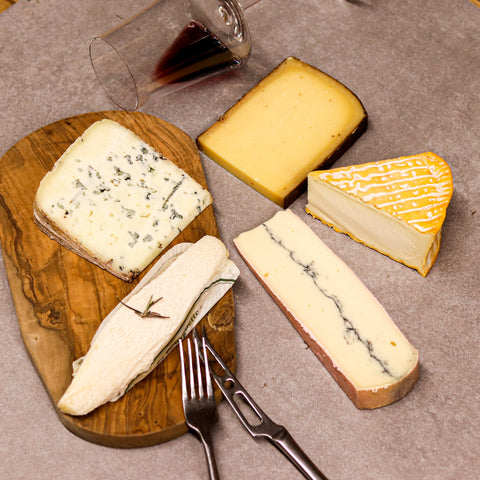 Close up of French artisan cheese with unique texture and rind