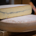Morbier AOP Marcel Petit with a line of ash through the centre